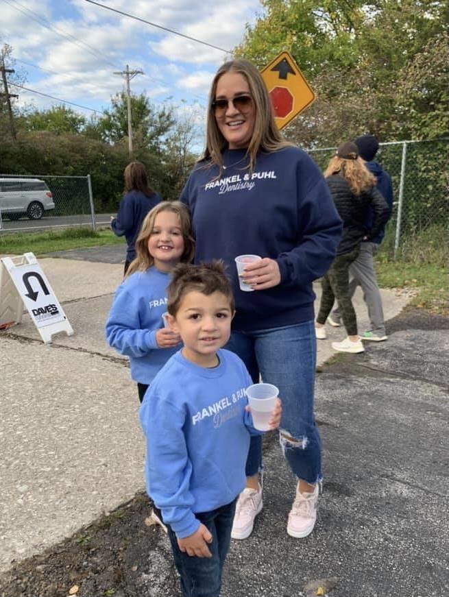 Toledo local organization Miles for Smiles walk. Mom and children walking as a form of exercise. 