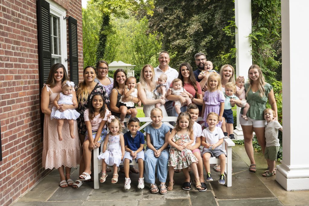 Family photo for Dental office in Toledo at the Wildwood Metroparks. A team of moms and their kids.